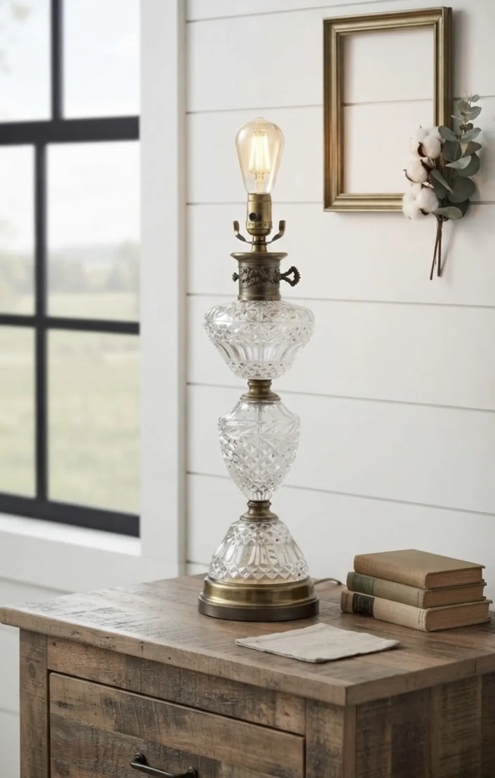 A rescued vintage glass lamp with an Edison bulb on a wood nightstand